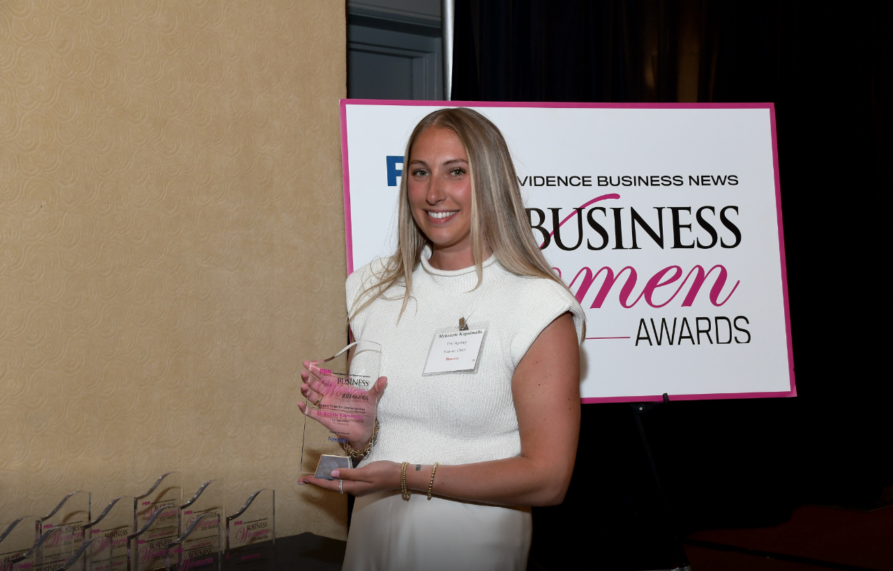 Tric Agency owner being awarded for being a Woman to Watch in Creative Services for 2025